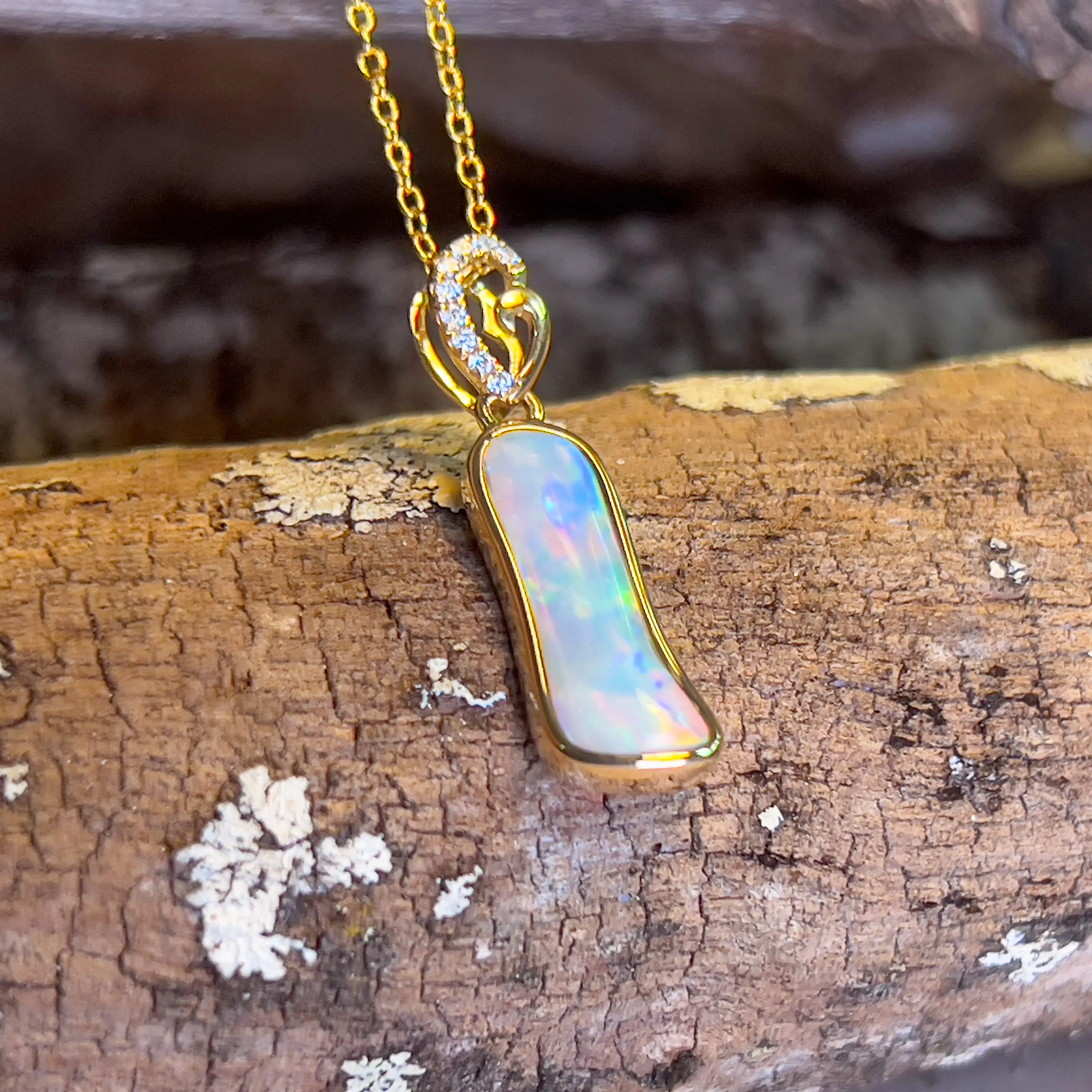 14kt Yellow Gold freeform Crystal Opal 1.05ct and diamond pendant