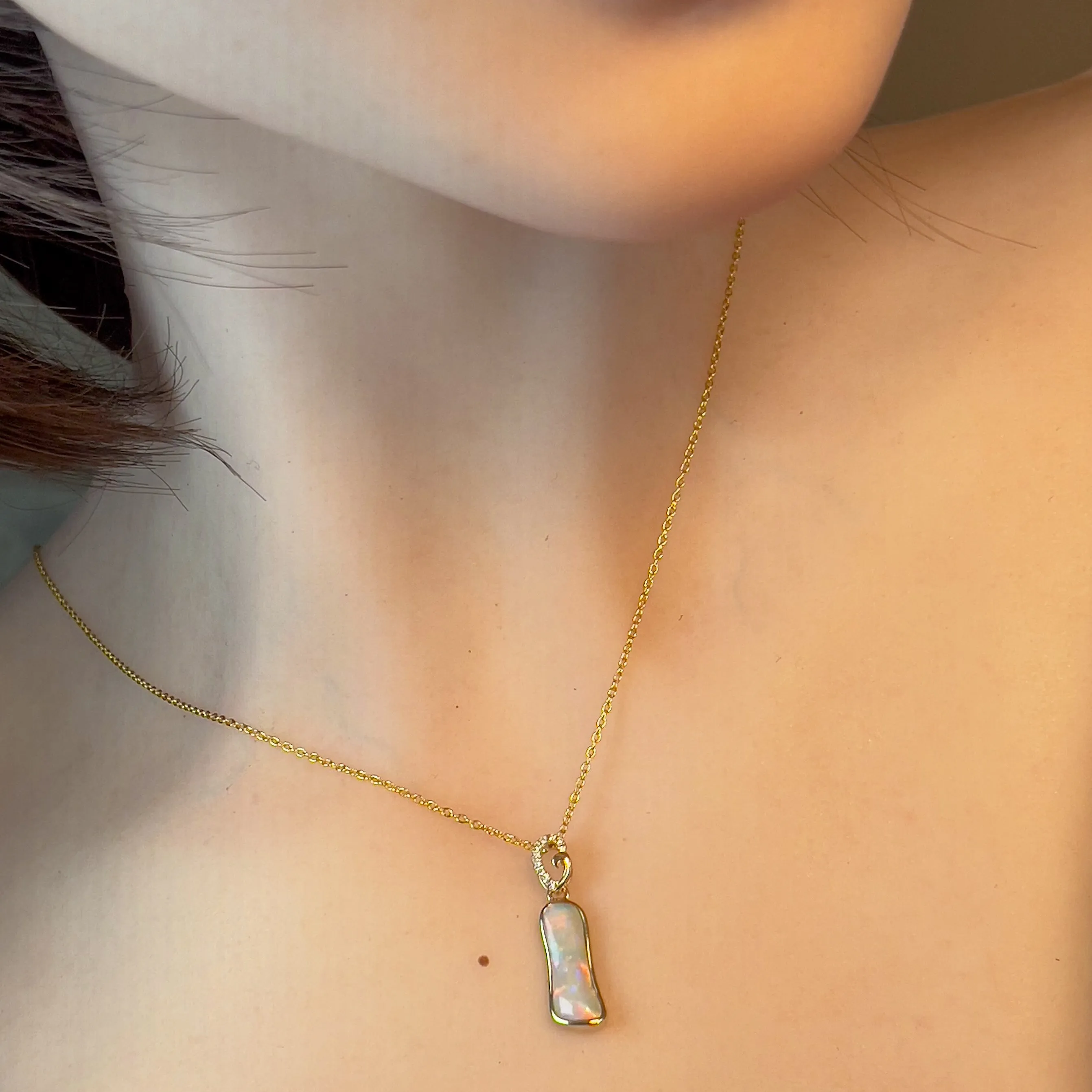 14kt Yellow Gold freeform Crystal Opal 1.05ct and diamond pendant